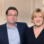 Man and woman seated together in a formal portrait for an article about Andrew Millican and Sarah Millican’s former marriage.