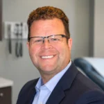Dr. Frank Scafuri Staten Island professional medical headshot in a clinic office