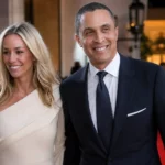 Emily Threlkeld and Harold Ford Jr. smiling together at a formal public event