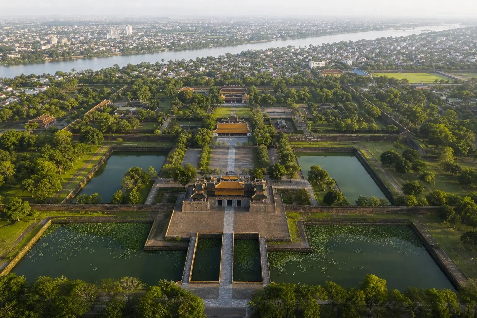 Aerial view of Hue Imperial Citadel with moat, gardens, and Perfume River in Vietnam