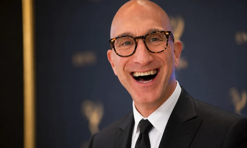Jeff Greenstein smiling in a black suit at an Emmy-style Hollywood event