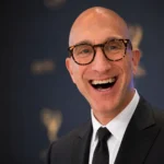 Jeff Greenstein smiling in a black suit at an Emmy-style Hollywood event