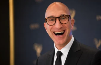 Jeff Greenstein smiling in a black suit at an Emmy-style Hollywood event