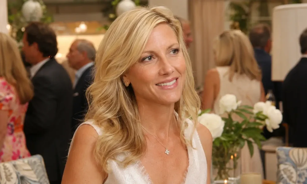 Kathryn Adams Limbaugh smiling at a formal public event with guests and floral decor in the background