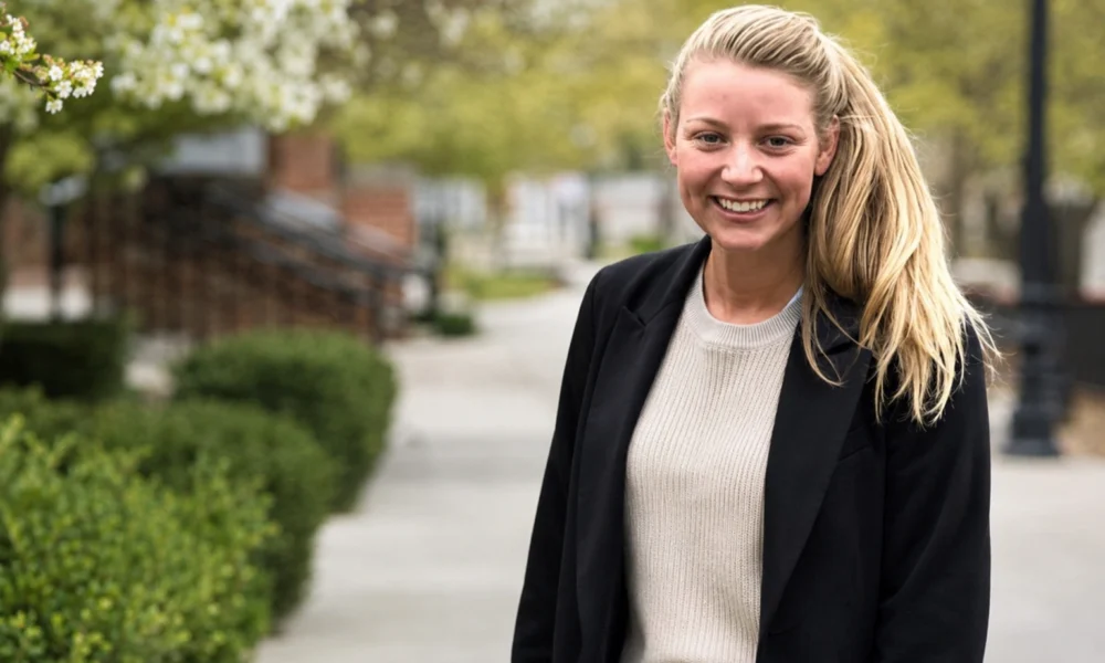 Katy Davis smiling outdoors, featured in an article about Suffield High School agriscience teacher