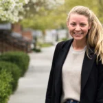 Katy Davis smiling outdoors, featured in an article about Suffield High School agriscience teacher