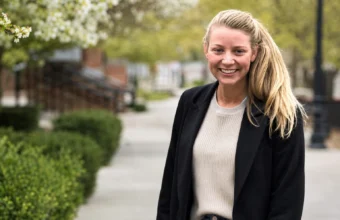Katy Davis smiling outdoors, featured in an article about Suffield High School agriscience teacher