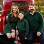 Illustrative family portrait for Kristy Greenberg husband article, showing a couple and child beside a red vintage truck