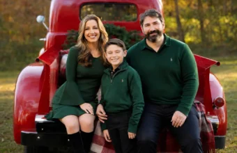 Illustrative family portrait for Kristy Greenberg husband article, showing a couple and child beside a red vintage truck