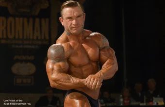 Lee Priest posing onstage at the 2006 IFBB Ironman Pro bodybuilding competition