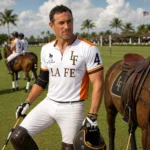 Louis Devaleix in La Fe polo jersey on a Wellington, Florida polo field beside a saddled horse
