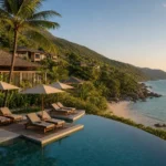 A luxury Vietnam beach resort with infinity pool, hillside villas, palm trees, and sweeping ocean views.