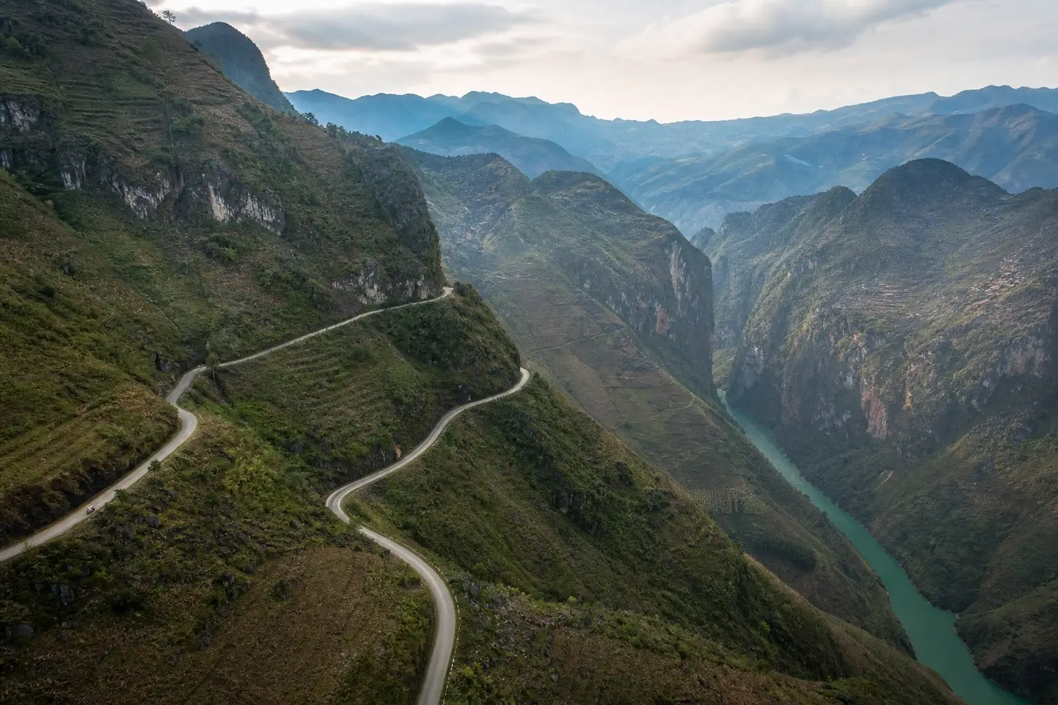 Ma Pi Leng Pass hairpin road above Nho Que River gorge in Ha Giang, Vietnam