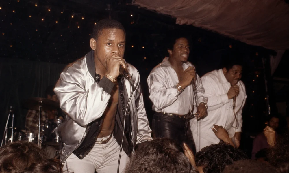 Master Gee performing live with The Sugarhill Gang during an early hip-hop concert