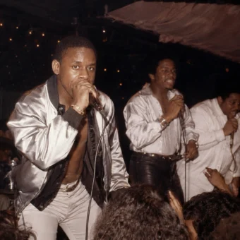 Master Gee performing live with The Sugarhill Gang during an early hip-hop concert