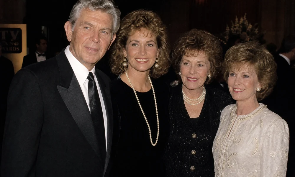 Dixie Griffith biography image with four people in formal evening attire at an event