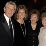 Dixie Griffith biography image with four people in formal evening attire at an event