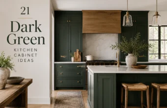 Dark green kitchen cabinets with wood range hood, brass hardware, marble island, and glass pendant lights