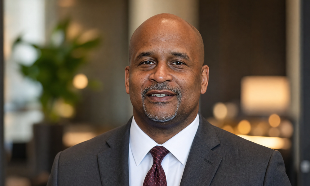 Dean Adkins MI professional portrait in a suit for biography profile