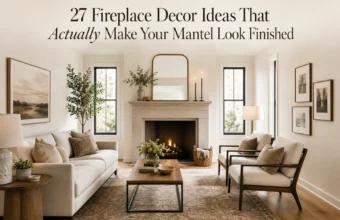 Elegant neutral living room with styled fireplace mantel, gold mirror, candles, sofa, and balanced seating.