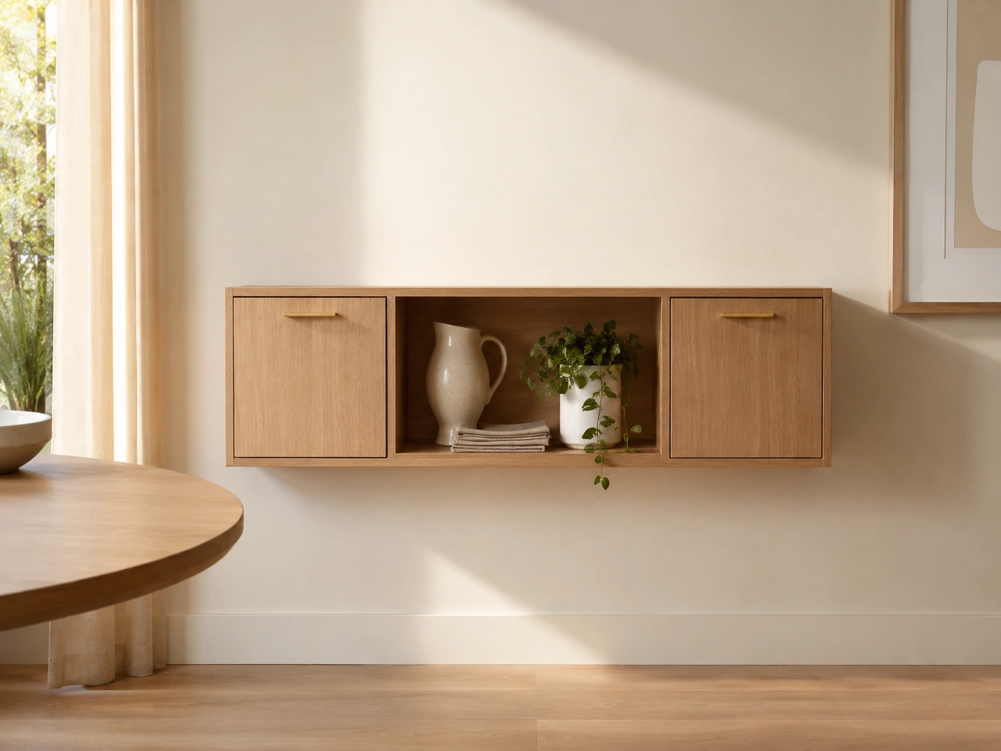 Floating oak dining room buffet with open shelf, ceramic pitcher, plant and linen napkins.