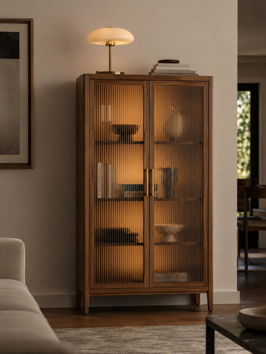 Wood fluted glass cabinet with warm lighting used as a modern living room accent feature.