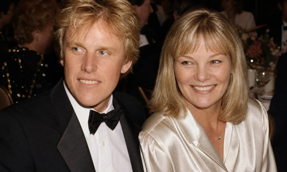 Gary Busey and Judy Helkenberg smiling together at a formal gala dinner in Los Angeles, circa 1985.