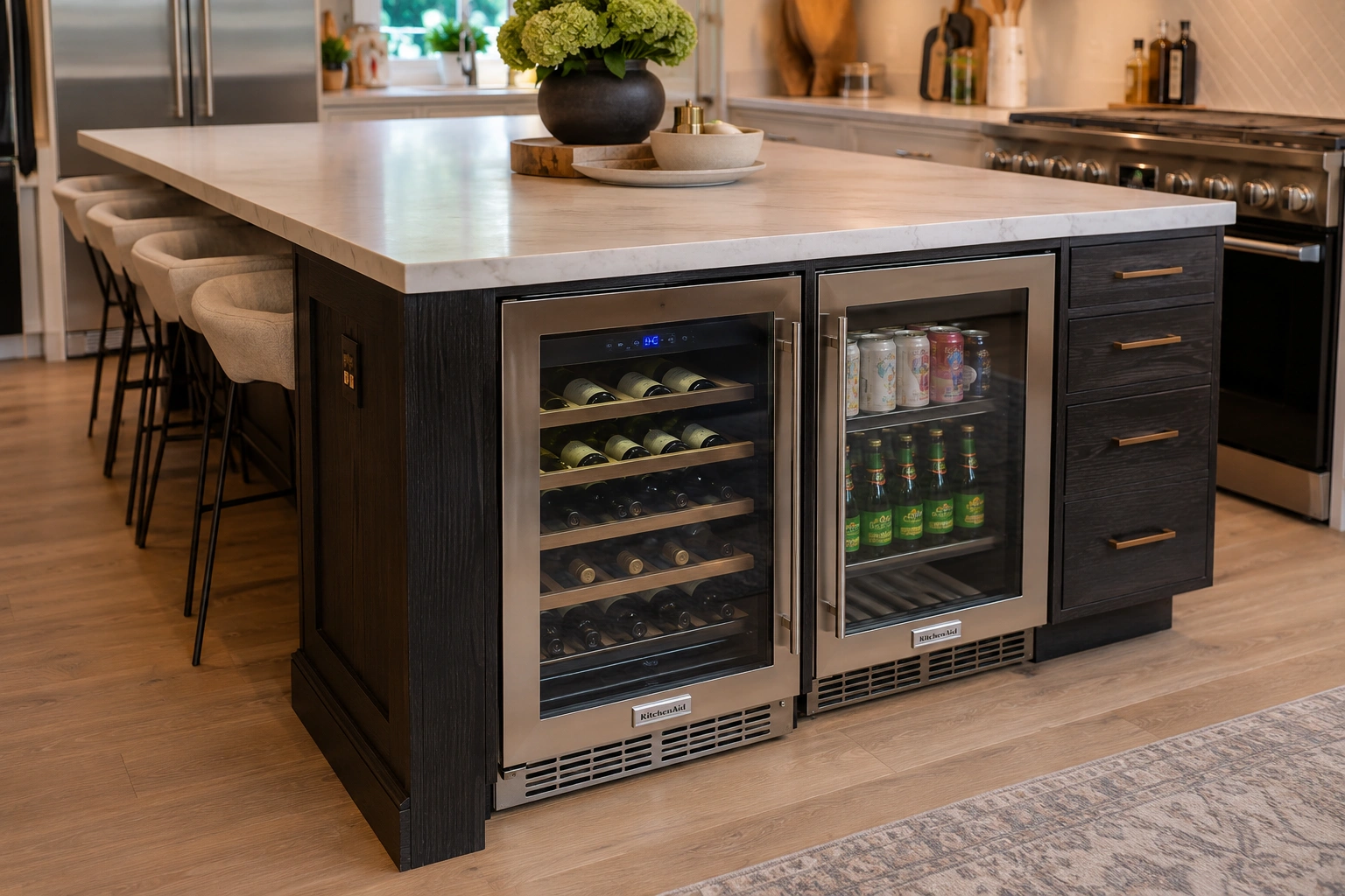 Kitchen island with integrated wine fridge and beverage refrigerator under a white countertop