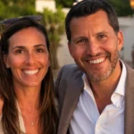 Woman Behind Will Cain: Kathleen Cain’s Full Story, Age, and Life Out of the Spotlight Smiling couple outdoors in a warm portrait-style scene for a Kathleen Cain biography article.