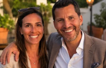 Smiling couple outdoors in a warm portrait-style scene for a Kathleen Cain biography article.