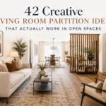 Open-plan living room with a wood slat partition, neutral sofa, dining area, and warm modern decor.