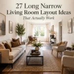 Long narrow living room with slim sofa, armchairs, narrow coffee table, layered rug, and clear walkway.