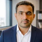 Lukman Hakeem-Mustafa Seyal portrait-style image in an office setting