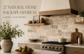 Cozy kitchen with natural stone backsplash, wood shelves, marble counters, and warm neutral styling.