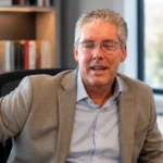 Steven Cauble seated in a professional office setting for a biography about his life beyond divorce.