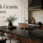 23 Real Kitchens With Black Granite Countertops That Actually Look High End Luxury kitchen with black granite countertops, wood island, brass faucet, white cabinets, and black range hood