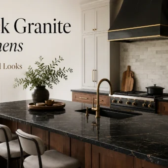 Luxury kitchen with black granite countertops, wood island, brass faucet, white cabinets, and black range hood