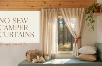 Beige no-sew camper curtains tied back with a red ribbon on an RV window, set within a cozy interior featuring an open book, a coffee mug, and a greening potted plant on a wooden shelf.