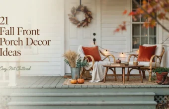Fall front porch decor ideas with wicker chairs, rust pillows, pumpkins, a wreath and string lights.