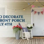Front porch decorated for July 4th with patriotic bunting, string lights, flowers, and white rocking chairs.