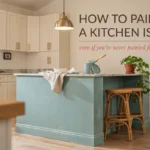 Modern white kitchen with a blue painted kitchen island, showing a DIY tutorial for painting a kitchen island.