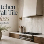 24 Kitchen Wall Tile Ideas for Full Walls, Accent Zones, and Small Kitchens Full-height glossy kitchen wall tile with wood cabinets, brass sconces, range hood, and marble island.