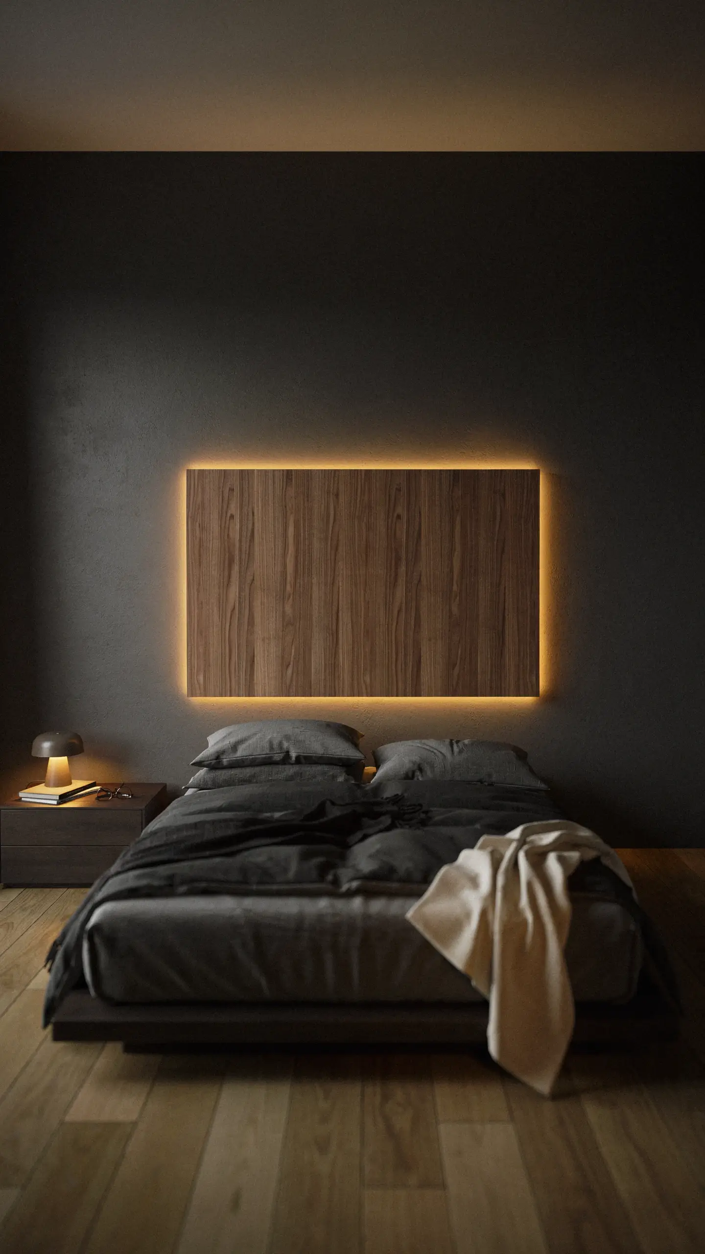 Dark grey modern bedroom interior featuring a floating wooden wall panel with ambient warm LED backlighting, a low-profile platform bed, and dark bedding. 