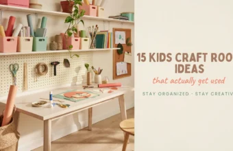 A bright, organized kids craft room featuring a white wooden table, a wall-mounted pegboard with scissors and tape, and floating shelves with pastel pink and green storage bins for paper and art supplies, with a corkboard displaying children's artwork.