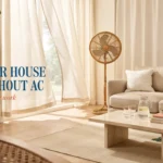 Bright airy living room with rattan fan, beige sofa, and water pitcher featuring text overlay "Keep Your House Cool Without AC" for summer tips.