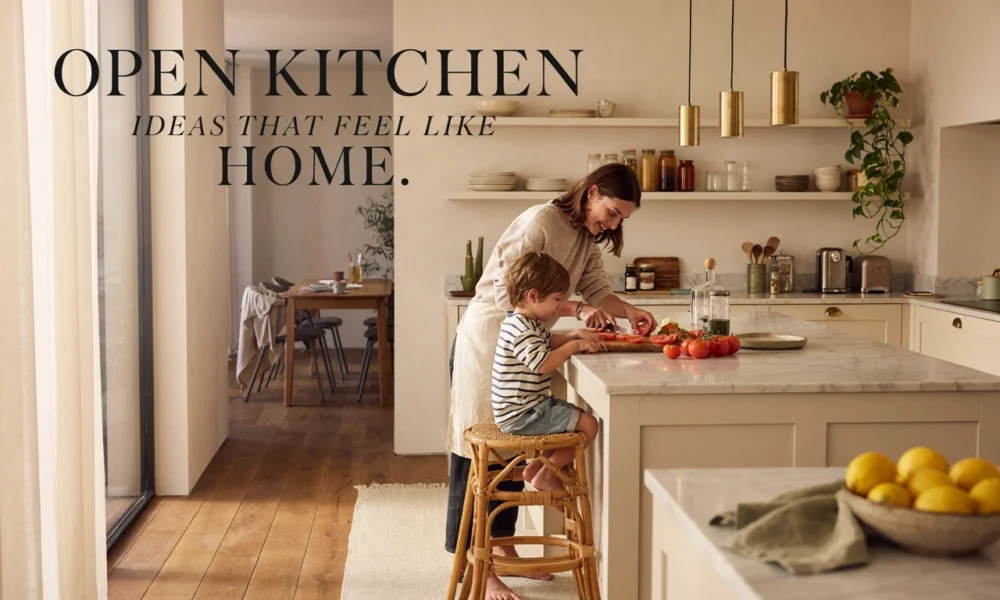 Modern open kitchen with a marble island where a mother and child prepare food together in a warm, bright open-concept home.