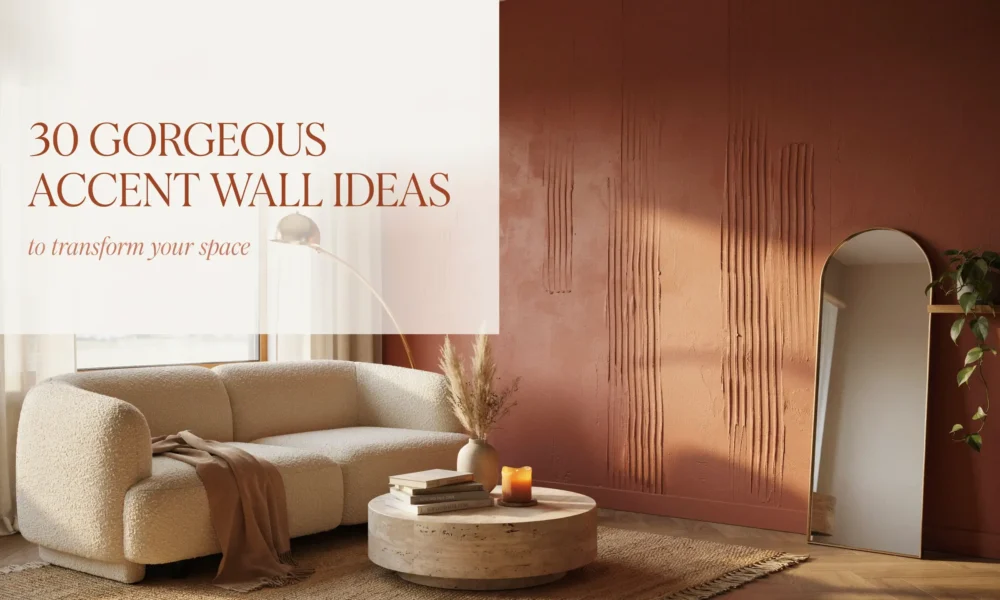 Modern living room featuring a textured terracotta accent wall, white boucle sofa, round travertine coffee table with books and candle, and arched floor mirror reflecting warm sunlight.