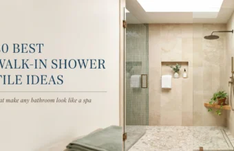 A modern spa bathroom featuring a walk-in shower with beige stone wall tiles, green vertical mosaic accent tiles in a built-in niche, a frameless glass enclosure with brass hardware, and a wooden floating shelf with a trailing green plant.