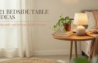 Round wooden bedside table styled with a ceramic lamp, stacked books, and a potted pothos plant next to a cozy bed. Text overlay reads: 21 bedside table ideas that make your bedroom feel like a retreat.