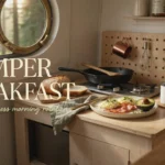 Cozy campervan breakfast with scrambled eggs, bacon, avocado, and coffee, viewed from a porthole window overlooking a misty pine forest, capturing a relaxing vanlife morning routine.